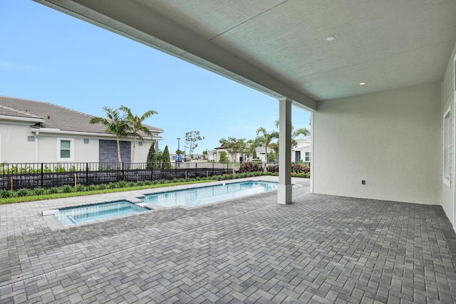 10051 Timber Creek Way, Palm Beach Gardens, FL 33412 - view of swimming pool with a patio and a pool with connected hot tub