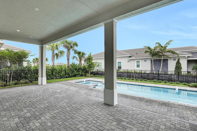 10051 Timber Creek Way, Palm Beach Gardens, FL 33412 - view of swimming pool with a pool with connected hot tub and a patio area