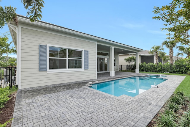 10051 Timber Creek Way, Palm Beach Gardens, FL 33412 - view of pool with a patio area and a pool with connected hot tub