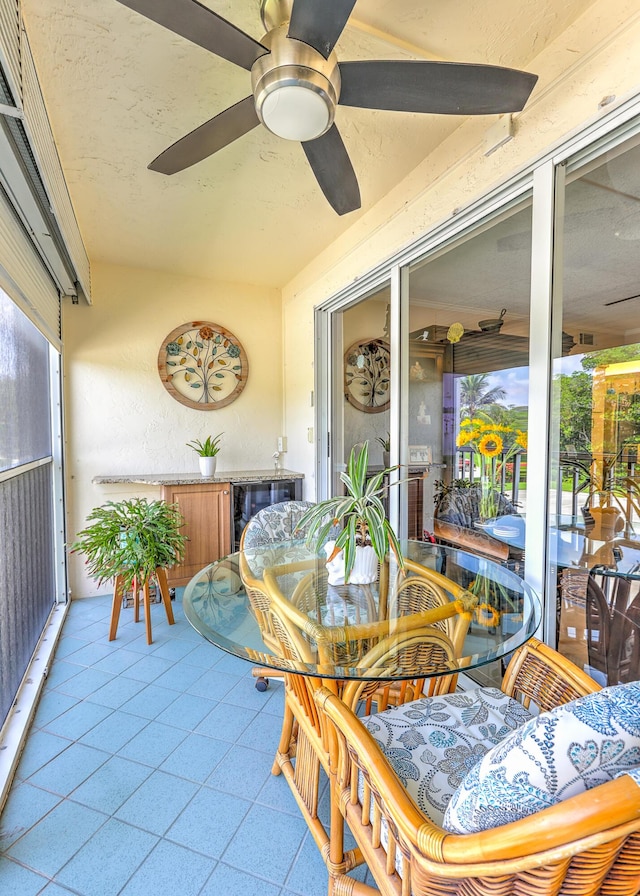 4452 NE Ocean Blvd Unit C2, Jensen Beach, FL 34957 - sunroom with ceiling fan and outdoor dining area