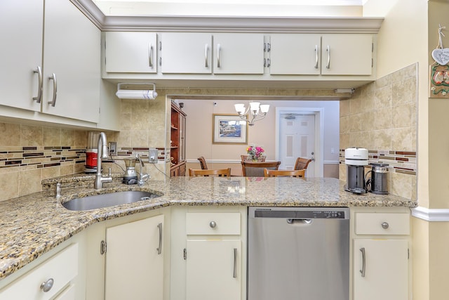 4452 NE Ocean Blvd Unit C2, Jensen Beach, FL 34957 - kitchen with stainless steel dishwasher, backsplash, a chandelier, and a peninsula