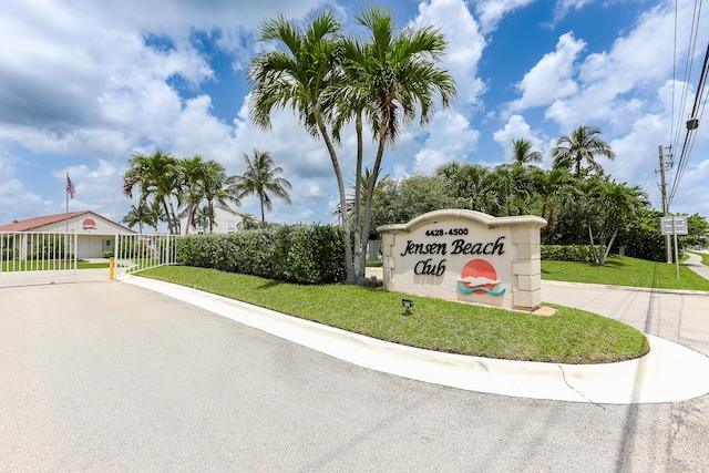4452 NE Ocean Blvd Unit C2, Jensen Beach, FL 34957 - community sign with a lawn and driveway