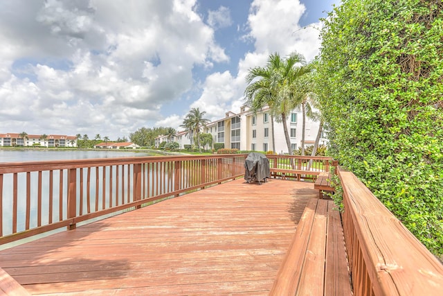 4452 NE Ocean Blvd Unit C2, Jensen Beach, FL 34957 - deck featuring a residential view, a water view, and grilling area