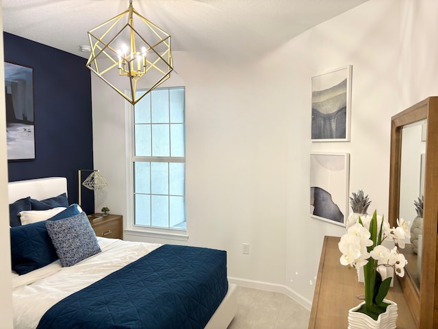 1236 Harper Way Unit 57, Vero Beach, FL 32960 - tiled bedroom with a chandelier and baseboards