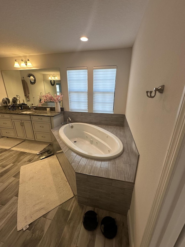 13106 Jeter Creek Dr, Riverview, FL 33579 - bathroom with a tub with jets and vanity