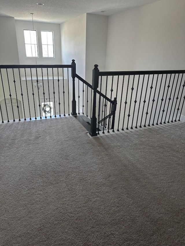 13106 Jeter Creek Dr, Riverview, FL 33579 - corridor with a textured ceiling, carpet, and an upstairs landing