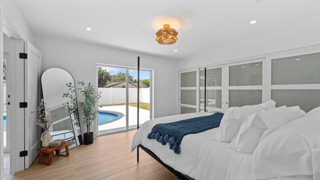 2654 NW 32nd St, Boca Raton, FL 33434 - bedroom with access to outside, light wood-style flooring, and recessed lighting