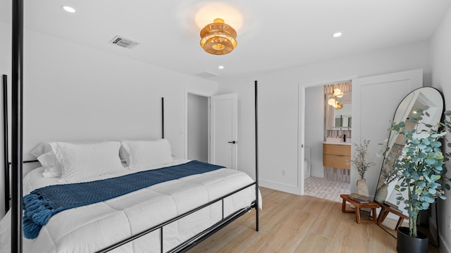 2654 NW 32nd St, Boca Raton, FL 33434 - bedroom with light wood-type flooring, recessed lighting, and ensuite bathroom