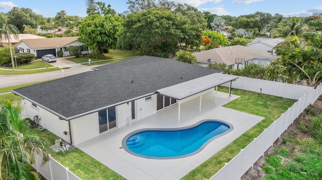 2654 NW 32nd St, Boca Raton, FL 33434 - view of swimming pool featuring a fenced backyard, a patio, and a residential view