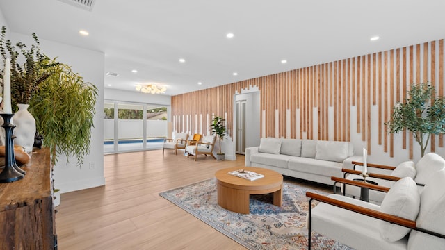 2654 NW 32nd St, Boca Raton, FL 33434 - living area with recessed lighting, wood finished floors, and wooden walls
