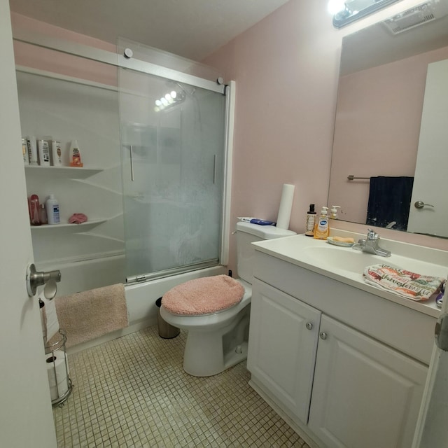 70 Easthampton C, West Palm Beach, FL 33417 - bathroom with vanity, combined bath / shower with glass door, and tile patterned flooring