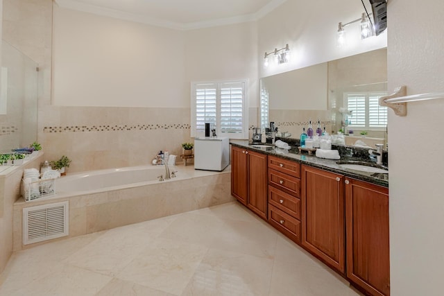 1101 SW Kickaboo Rd, Port Saint Lucie, FL 34953 - bathroom with a bath, double vanity, and crown molding