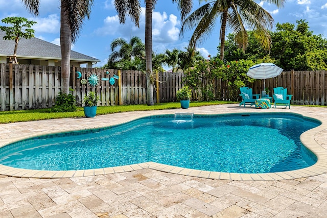 1101 SW Kickaboo Rd, Port Saint Lucie, FL 34953 - view of pool with a fenced backyard and a patio area
