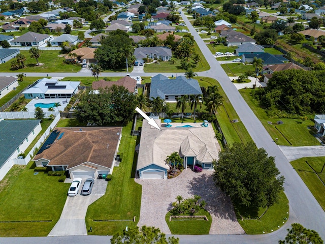 1101 SW Kickaboo Rd, Port Saint Lucie, FL 34953 - aerial view of property and surrounding area featuring a pool area and nearby suburban area