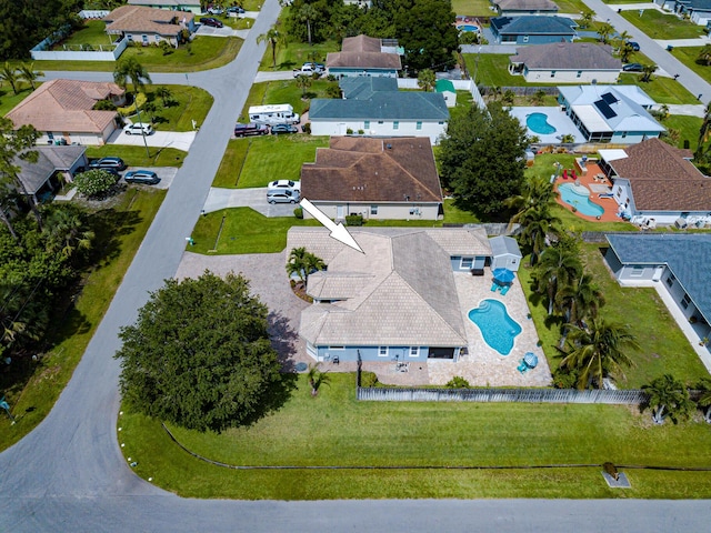 1101 SW Kickaboo Rd, Port Saint Lucie, FL 34953 - aerial perspective of suburban area with a pool area