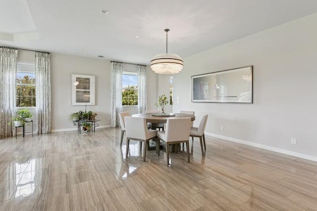 242 Tresana Blvd Unit 70, Jupiter, FL 33478 - dining area featuring a chandelier and light wood-style floors