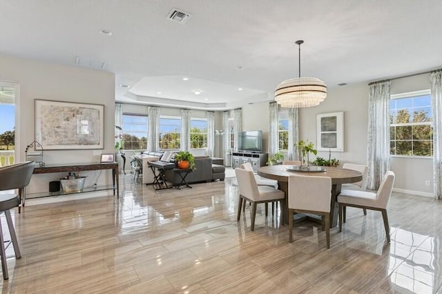 242 Tresana Blvd Unit 70, Jupiter, FL 33478 - dining space with a tray ceiling, recessed lighting, and a chandelier