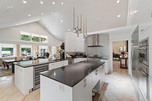 13709 Rivoli Dr, Palm Beach Gardens, FL 33410 - kitchen featuring beverage cooler, modern cabinets, high vaulted ceiling, stainless steel appliances, and a center island