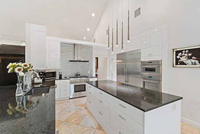 13709 Rivoli Dr, Palm Beach Gardens, FL 33410 - kitchen featuring high end appliances, wall chimney exhaust hood, high vaulted ceiling, modern cabinets, and a center island