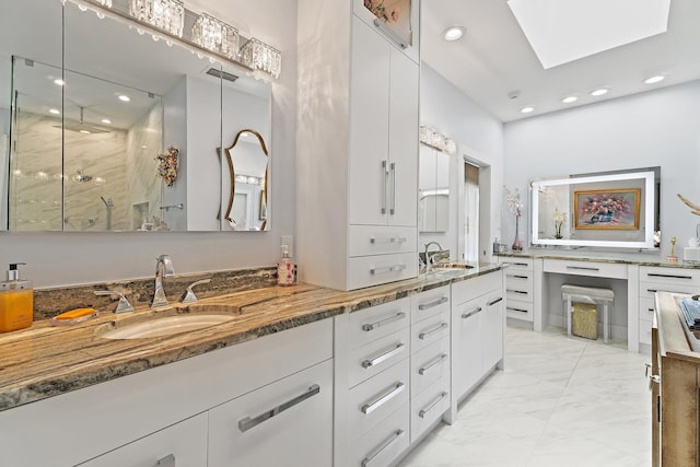 13709 Rivoli Dr, Palm Beach Gardens, FL 33410 - bathroom with marble look tile flooring, double vanity, a marble finish shower, recessed lighting, and a skylight