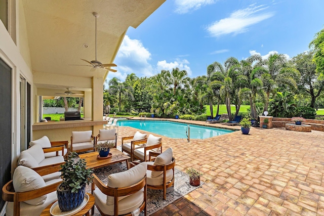 13709 Rivoli Dr, Palm Beach Gardens, FL 33410 - swimming pool with a patio, view of scattered trees, ceiling fan, an outdoor hangout area, and a grill