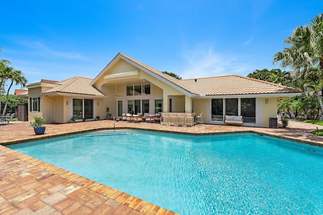 13709 Rivoli Dr, Palm Beach Gardens, FL 33410 - swimming pool featuring an outdoor living space and a patio