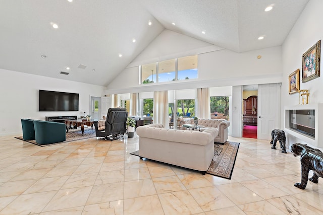 13709 Rivoli Dr, Palm Beach Gardens, FL 33410 - living room with high vaulted ceiling, recessed lighting, and light marble finish floors