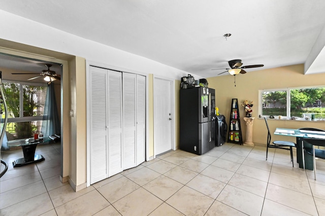 3560 SW 63rd Ave, Miramar, FL 33023 - kitchen with stainless steel fridge, ceiling fan, and light tile patterned floors