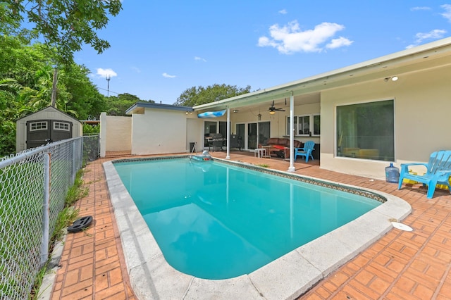 3560 SW 63rd Ave, Miramar, FL 33023 - view of swimming pool with a ceiling fan, a patio area, and a storage unit