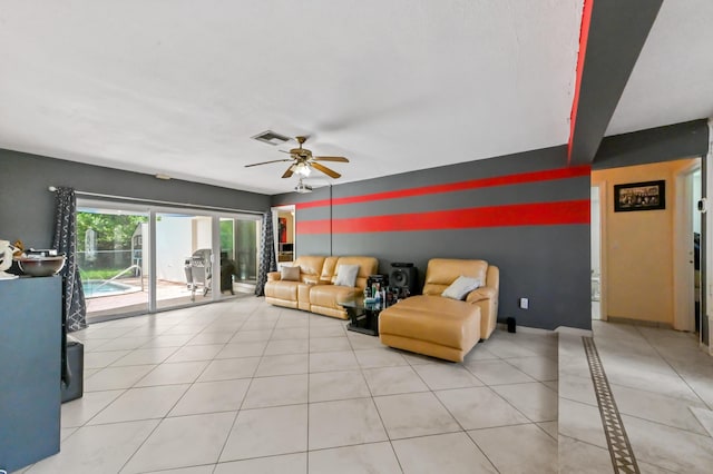 3560 SW 63rd Ave, Miramar, FL 33023 - living room with a ceiling fan, tile patterned floors, and an accent wall