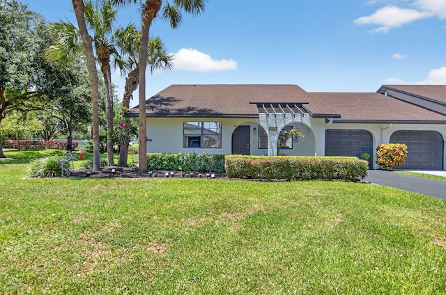 8811 SW 21st Ct Unit B, Boca Raton, FL 33433 - view of front of house with a garage, stucco siding, driveway, a front yard, and roof with shingles
