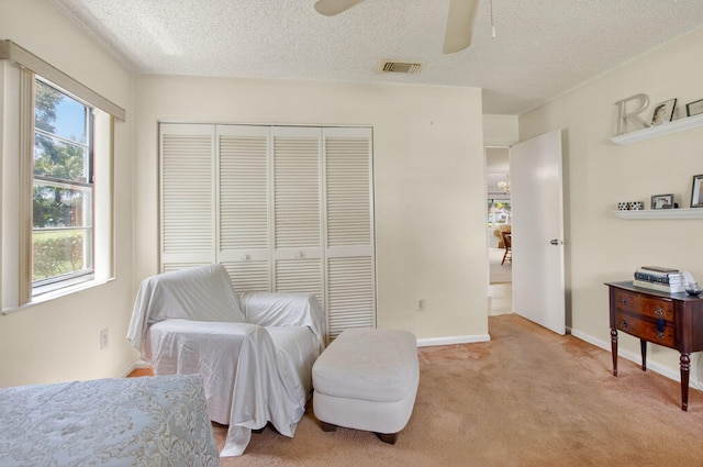 8811 SW 21st Ct Unit B, Boca Raton, FL 33433 - living area with plenty of natural light, a ceiling fan, light colored carpet, and a textured ceiling