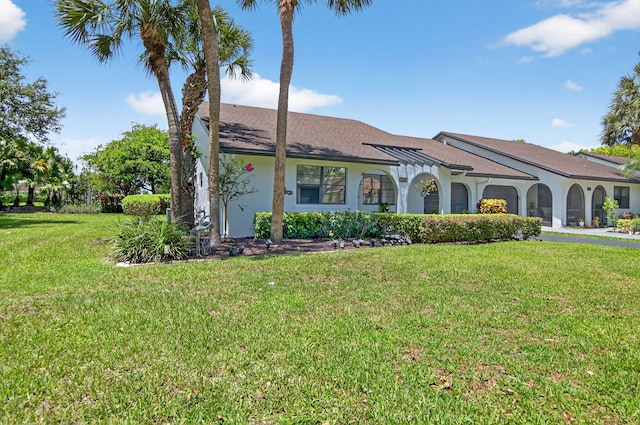 8811 SW 21st Ct Unit B, Boca Raton, FL 33433 - view of front of house featuring a front yard, stucco siding, and an attached garage