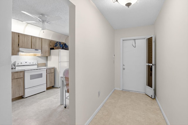 8811 SW 21st Ct Unit B, Boca Raton, FL 33433 - kitchen featuring white appliances, under cabinet range hood, a textured ceiling, ceiling fan, and light countertops