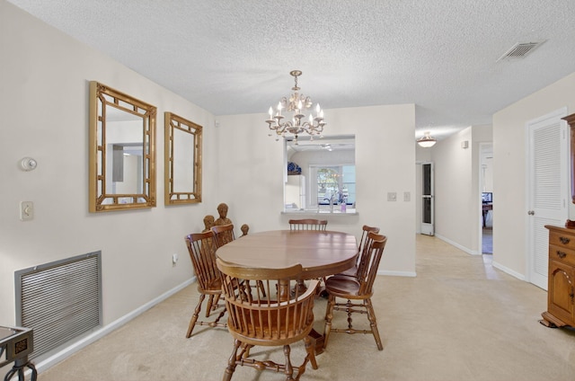 8811 SW 21st Ct Unit B, Boca Raton, FL 33433 - dining space featuring a chandelier, light colored carpet, and a textured ceiling