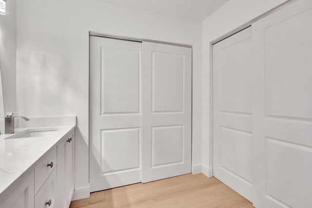3540 S Ocean Blvd Ph 911, South Palm Beach, FL 33480 - bathroom with wood finished floors and vanity