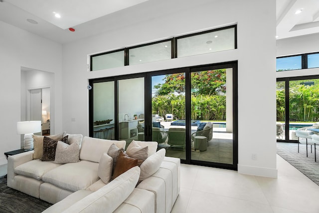 17 NW 15th St, Delray Beach, FL 33444 - living room with a towering ceiling, recessed lighting, and light tile patterned floors
