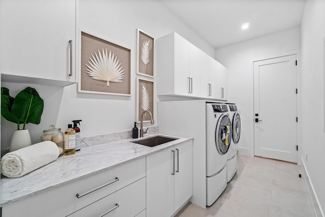 17 NW 15th St, Delray Beach, FL 33444 - laundry room with washer and clothes dryer, light tile patterned floors, cabinet space, and recessed lighting