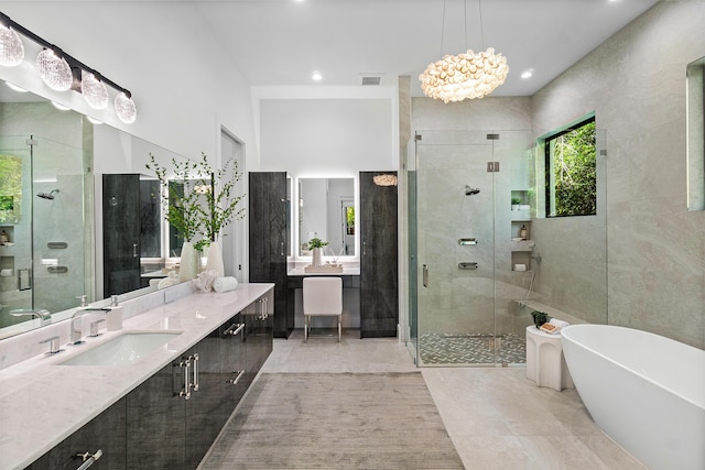 17 NW 15th St, Delray Beach, FL 33444 - full bathroom featuring a shower stall, vanity, a freestanding bath, a chandelier, and recessed lighting