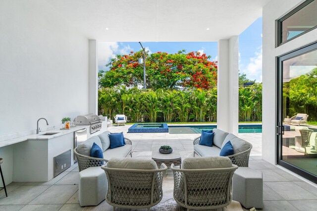 17 NW 15th St, Delray Beach, FL 33444 - view of patio / terrace with exterior kitchen and a pool with connected hot tub