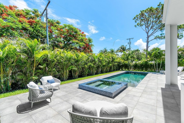 17 NW 15th St, Delray Beach, FL 33444 - view of swimming pool featuring a patio area and a pool with connected hot tub