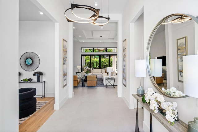 17 NW 15th St, Delray Beach, FL 33444 - hall featuring a tray ceiling, a chandelier, and recessed lighting