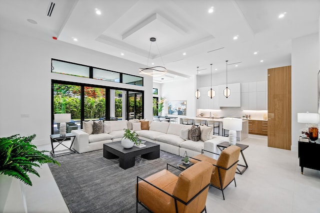 17 NW 15th St, Delray Beach, FL 33444 - living area featuring a tray ceiling, a towering ceiling, recessed lighting, and light tile patterned floors