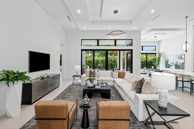 17 NW 15th St, Delray Beach, FL 33444 - living room featuring a high ceiling, a raised ceiling, and recessed lighting