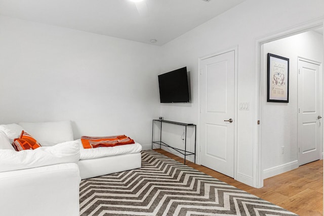 674 NW Library Commons Way, Boca Raton, FL 33432 - living room with light wood finished floors and baseboards