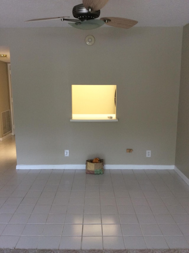 470 Executive Center Dr Unit 2K, West Palm Beach, FL 33401 - spare room featuring light tile patterned flooring and ceiling fan