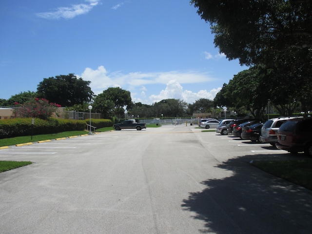 470 Executive Center Dr Unit 2K, West Palm Beach, FL 33401 - view of asphalt street featuring street lights