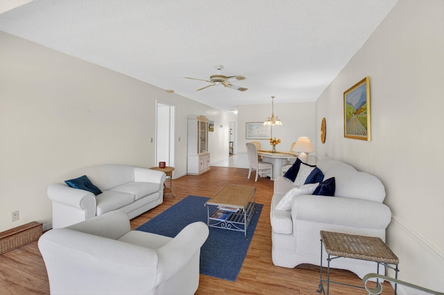 1030 Citrus Way Unit 204, Delray Beach, FL 33445 - living room featuring wood finished floors, a chandelier, and ceiling fan
