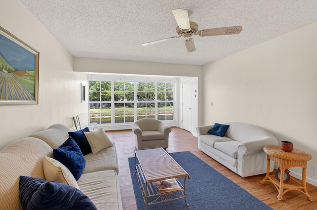 1030 Citrus Way Unit 204, Delray Beach, FL 33445 - living room with wood finished floors, a textured ceiling, and a ceiling fan