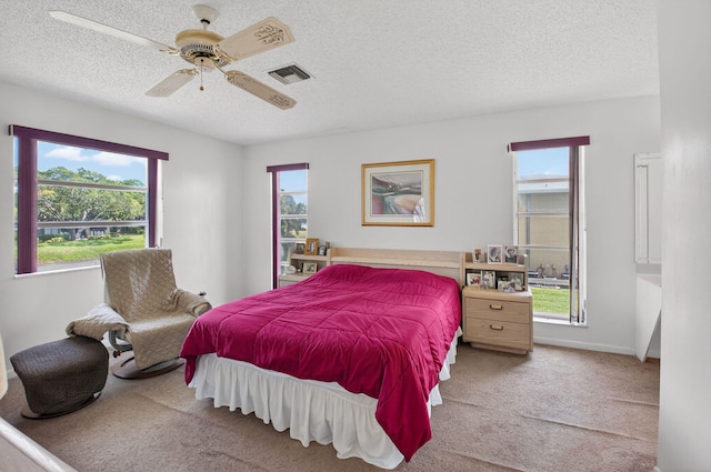 1030 Citrus Way Unit 204, Delray Beach, FL 33445 - carpeted bedroom with a textured ceiling and ceiling fan
